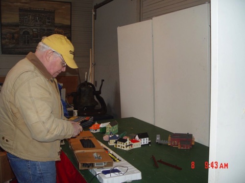 2010-01-08 Bill dismantling the model RR setup from the holiday display. DSC06169.jpg